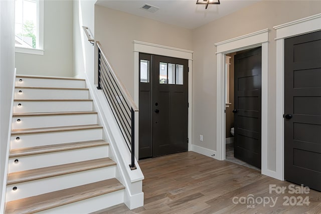 foyer entrance with light hardwood / wood-style flooring