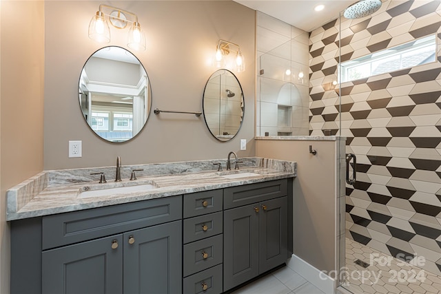 bathroom with a shower with shower door and vanity