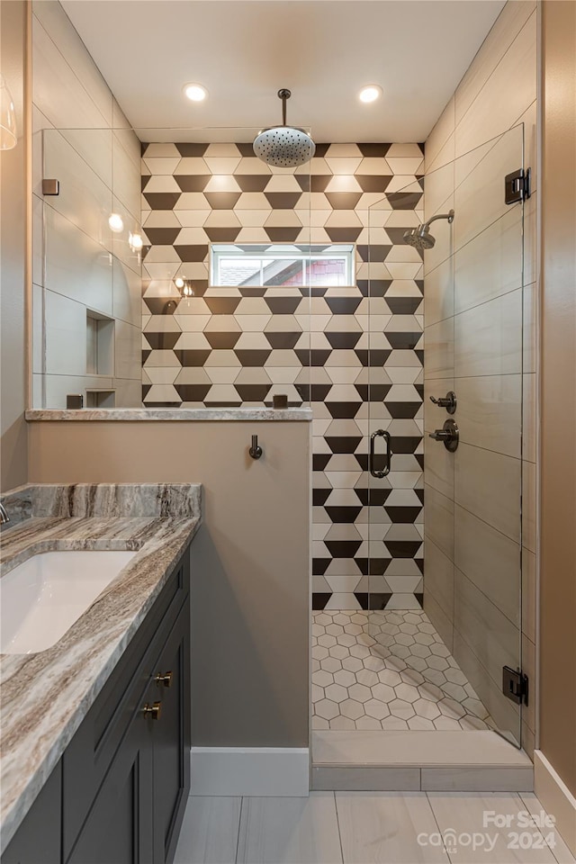 bathroom with vanity and walk in shower