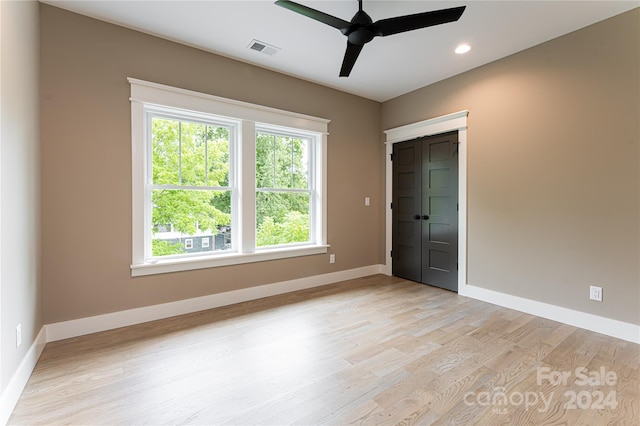 unfurnished room featuring ceiling fan and light hardwood / wood-style floors