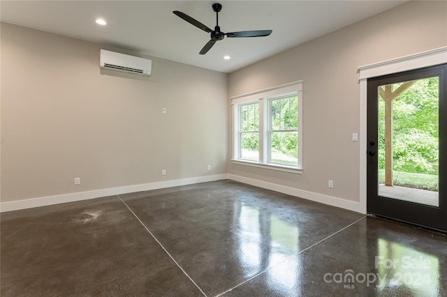 empty room with ceiling fan and a wall mounted AC