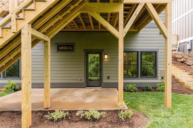 view of exterior entry featuring a patio