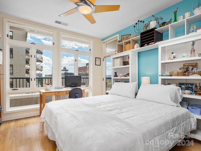 bedroom with ceiling fan, light hardwood / wood-style floors, and access to outside