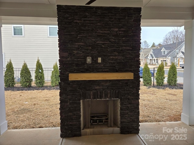 view of patio with an outdoor stone fireplace