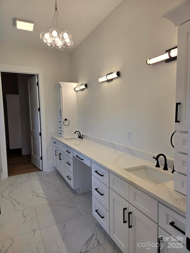 bathroom with vanity and a notable chandelier