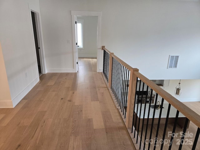 hallway with light wood-type flooring