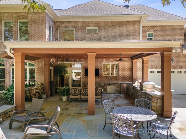 back of house with area for grilling, ceiling fan, and a patio area