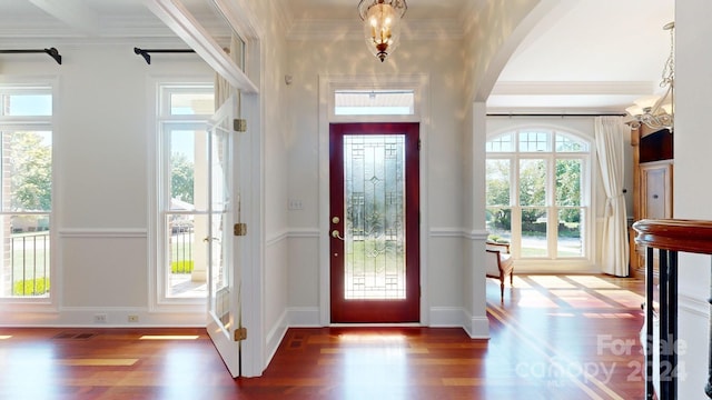 foyer featuring hardwood / wood-style flooring and ornamental molding