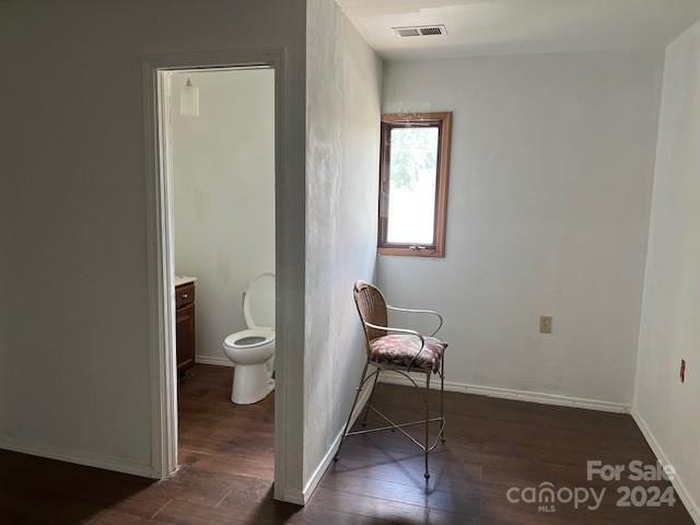 bathroom featuring wood-type flooring, vanity, and toilet