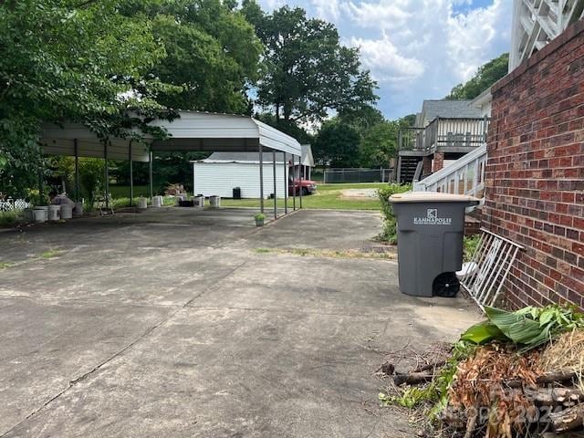 exterior space featuring a deck and a carport