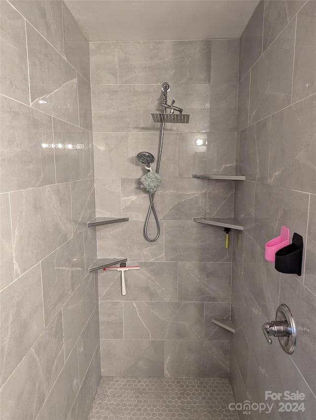 bathroom with a tile shower