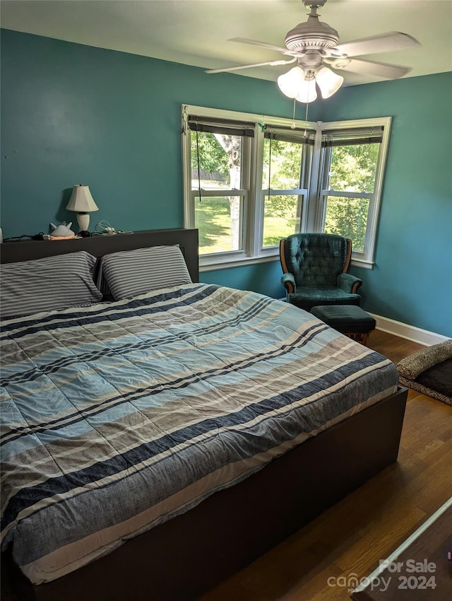 bedroom featuring ceiling fan and hardwood / wood-style flooring