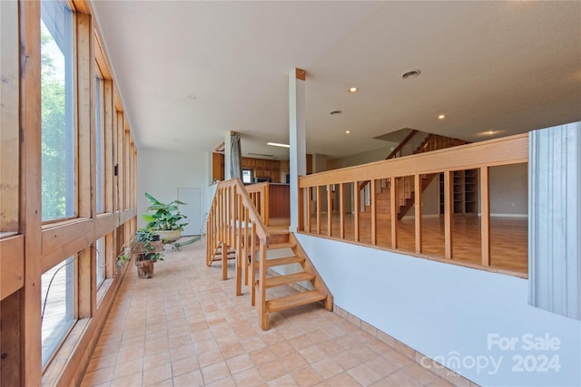 staircase featuring a wealth of natural light