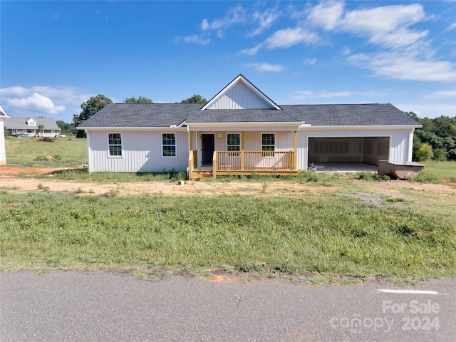 single story home with a garage and a front yard