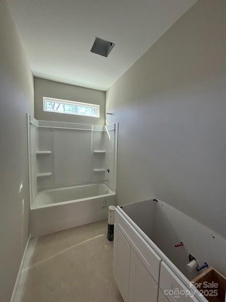 bathroom with washtub / shower combination