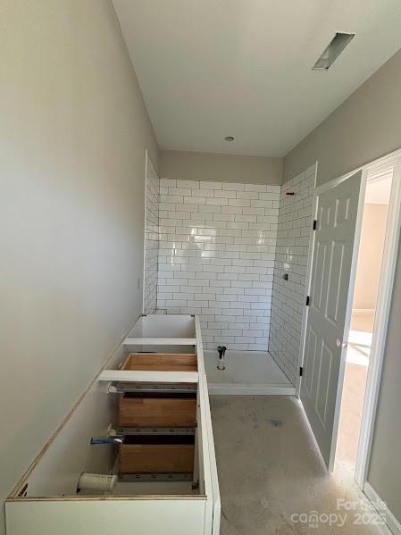 bathroom featuring concrete flooring