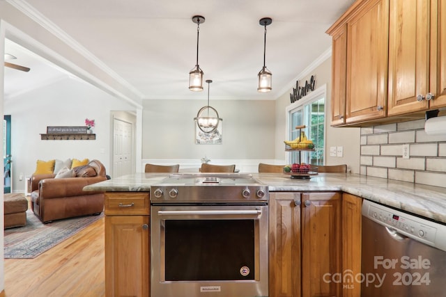 kitchen featuring crown molding, decorative backsplash, light stone countertops, appliances with stainless steel finishes, and kitchen peninsula