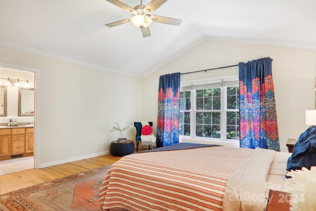 bedroom with ceiling fan, lofted ceiling, light hardwood / wood-style flooring, and ensuite bath