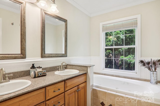 bathroom with vanity, tiled bath, and ornamental molding