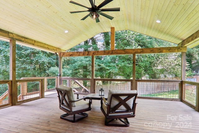 sunroom / solarium with lofted ceiling, ceiling fan, and wooden ceiling