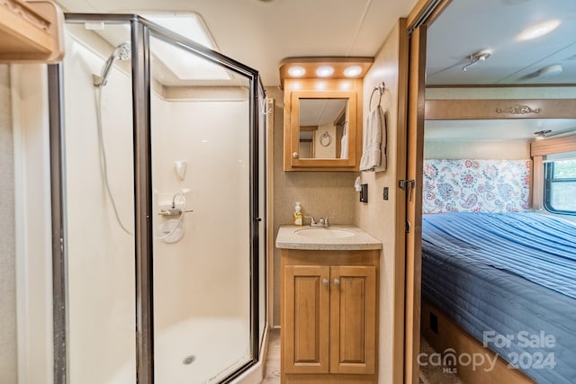 bathroom featuring vanity and walk in shower