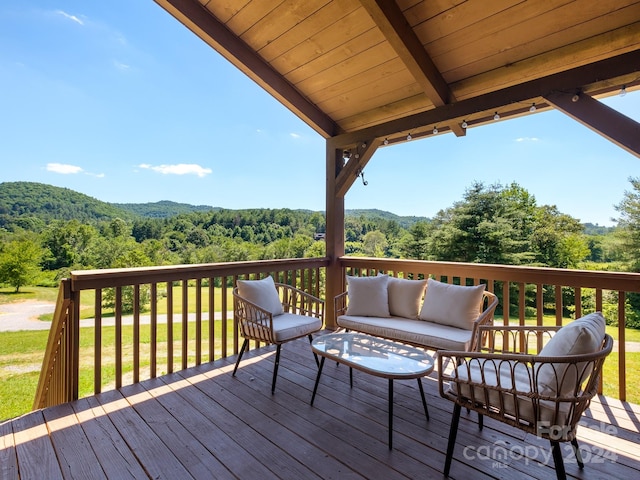 deck featuring outdoor lounge area