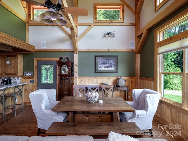 dining room featuring high vaulted ceiling, ceiling fan, and hardwood / wood-style flooring