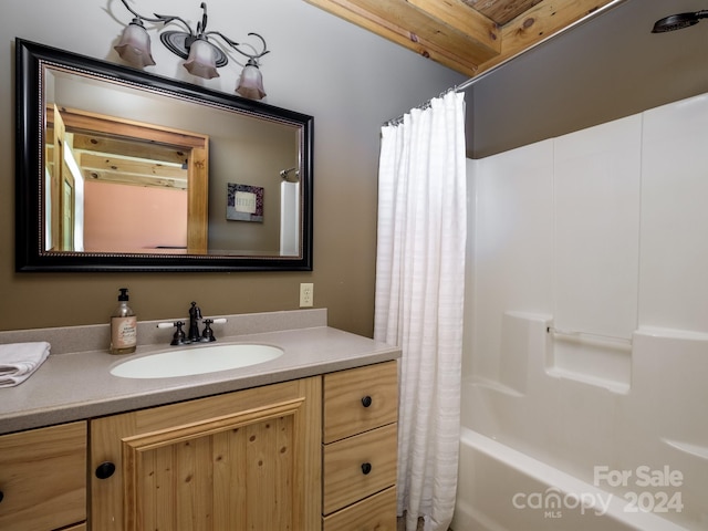 bathroom with vanity and shower / tub combo with curtain