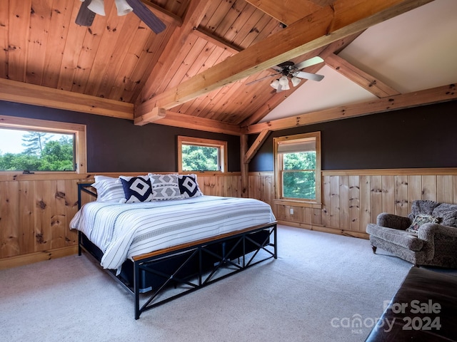 bedroom with carpet floors, lofted ceiling with beams, wood walls, and wooden ceiling