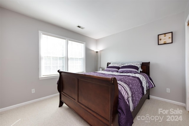 bedroom with light carpet