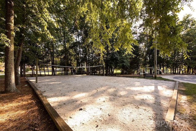 view of community featuring a playground and volleyball court