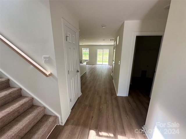 corridor featuring dark hardwood / wood-style floors