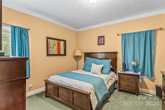 carpeted bedroom featuring crown molding and a textured ceiling