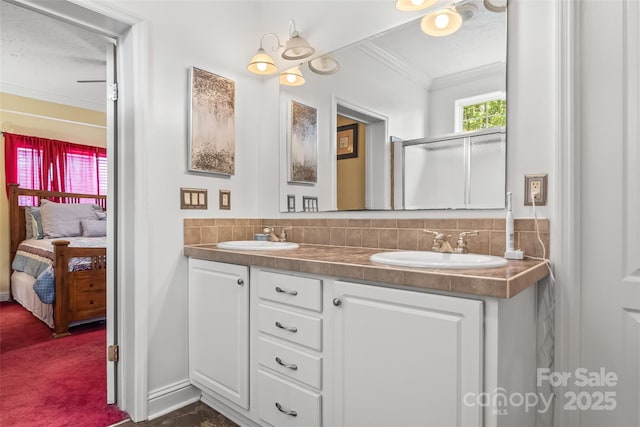 3951 Springs Rd, Conover, NC 28613 - ensuite bathroom with crown molding, double vanity, decorative backsplash, and baseboards