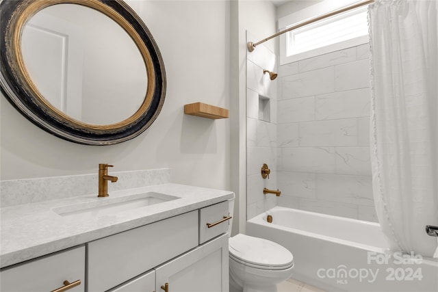 full bathroom featuring vanity, toilet, and shower / bathtub combination with curtain