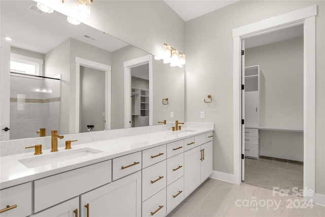 bathroom with vanity and an enclosed shower