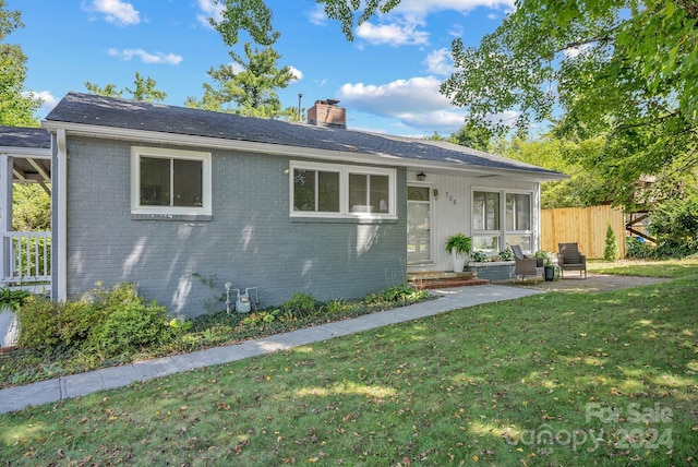 ranch-style house with a front yard