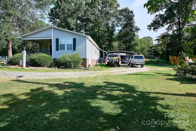 view of home's exterior featuring a lawn and a porch