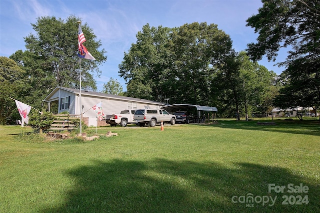 view of yard with a carport