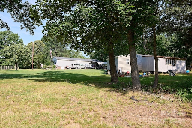 view of yard featuring a storage shed