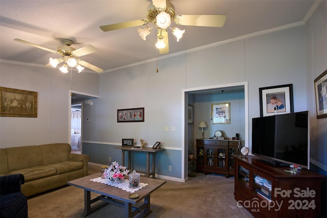 living room featuring carpet, ceiling fan, and ornamental molding