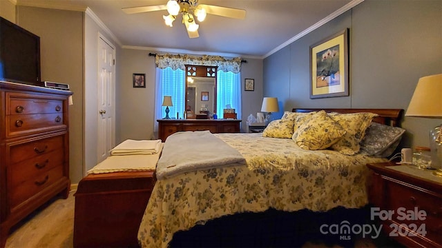 bedroom featuring ceiling fan, crown molding, and light colored carpet