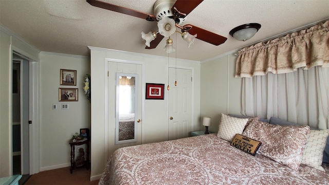 bedroom with a textured ceiling, ceiling fan, and ornamental molding