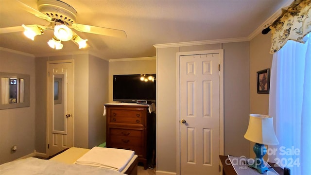 bedroom featuring ceiling fan and ornamental molding