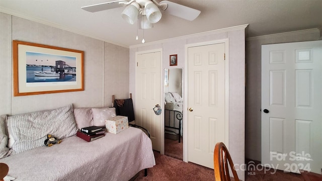 carpeted bedroom featuring ceiling fan and ornamental molding