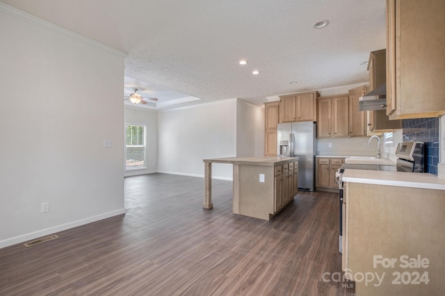 kitchen with appliances with stainless steel finishes, decorative backsplash, dark hardwood / wood-style floors, a kitchen island, and crown molding