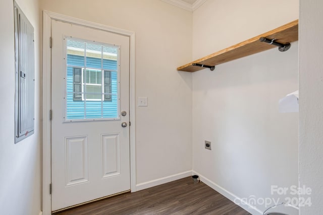 washroom featuring dark hardwood / wood-style flooring, ornamental molding, and hookup for an electric dryer