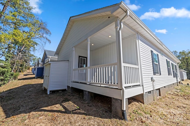 view of property exterior with covered porch