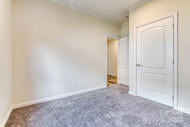 unfurnished bedroom with carpet flooring and ornamental molding