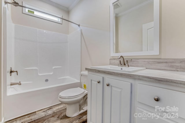 full bathroom featuring vanity, crown molding, shower / bathtub combination, hardwood / wood-style floors, and toilet